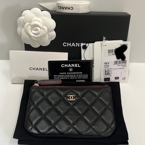 CHANEL Handbags - NWT CHANEL MINI CLASSIC O POUCH Black Lambskin with Gold Hardware
